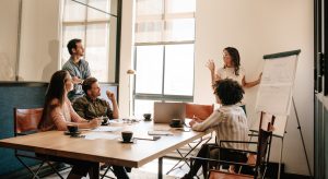 Creative business team having new project discussion in conference room. Businessman and woman meeting in boardroom for exploring new business strategies.