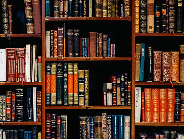 An old fashioned bookshelf case within a library.