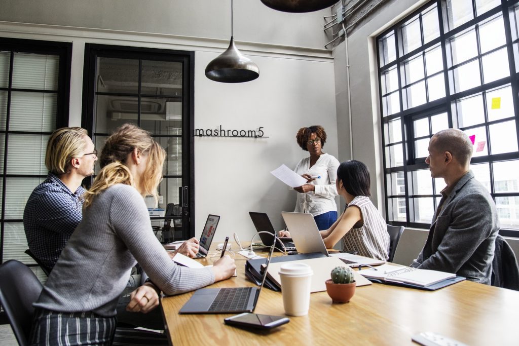 management education professionals in a team meeting.