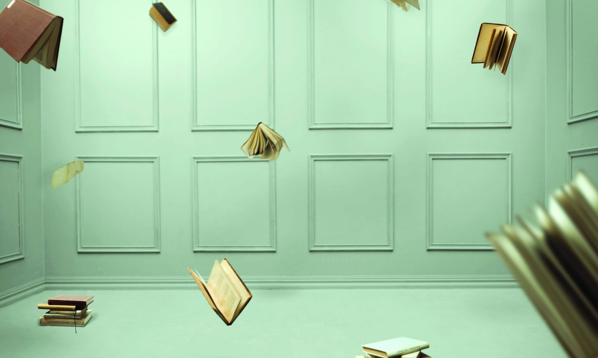 Here are multiple falling books in a closed pale green room.