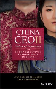 Here is the front cover of a red and black book with two individuals of Chinese ethnicity, both wearing traditional Chinese outfits. This book states 'China CEOII; voices from experience from 25 top executives leading MNCs in China' by Authors Juan Antonio Fernandez and Laurie Underwood.