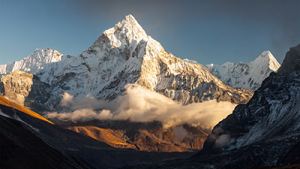 Here is a landscape view of mountains in snow and a view of the summit.