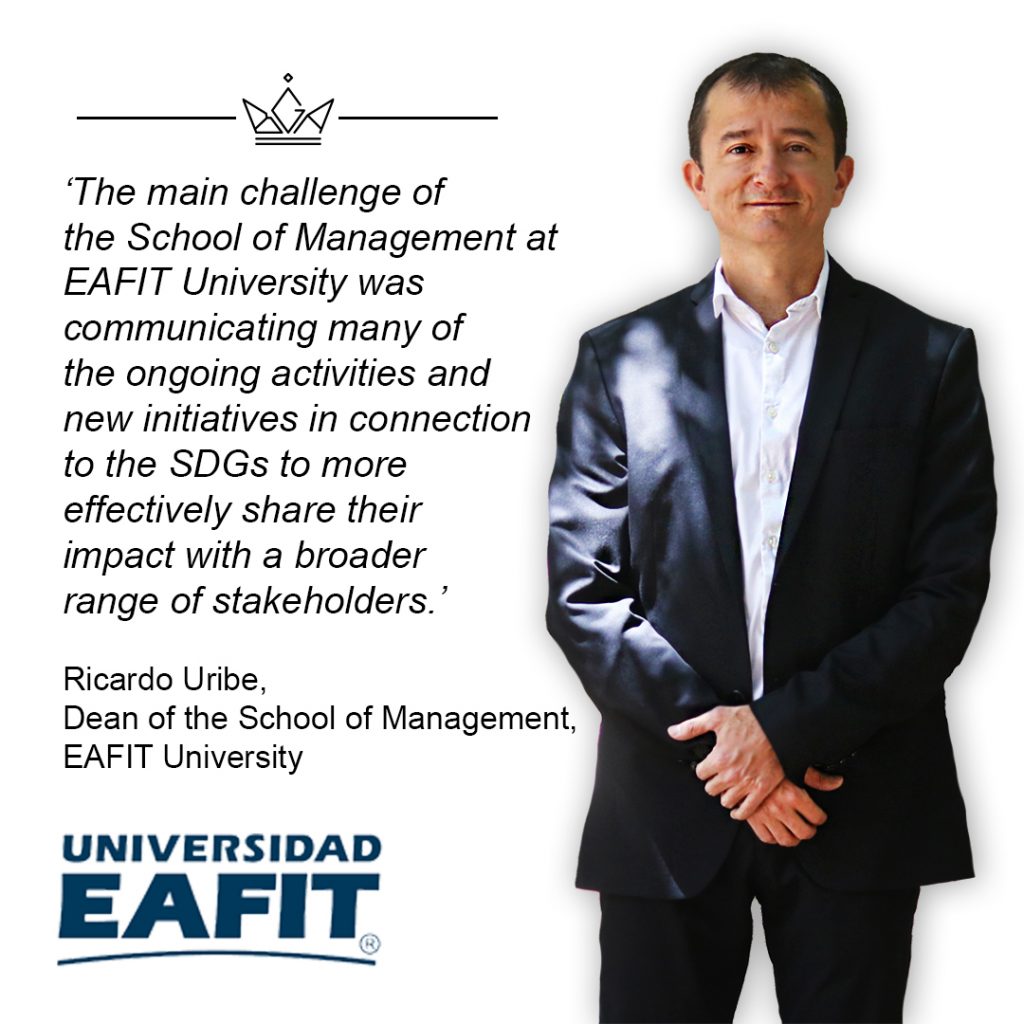 A banner with the Dean of EAFIT University standing with hands crossed over supported by the wrists. There is also text which quotes the main Business School challenge and a logo of the Business School.